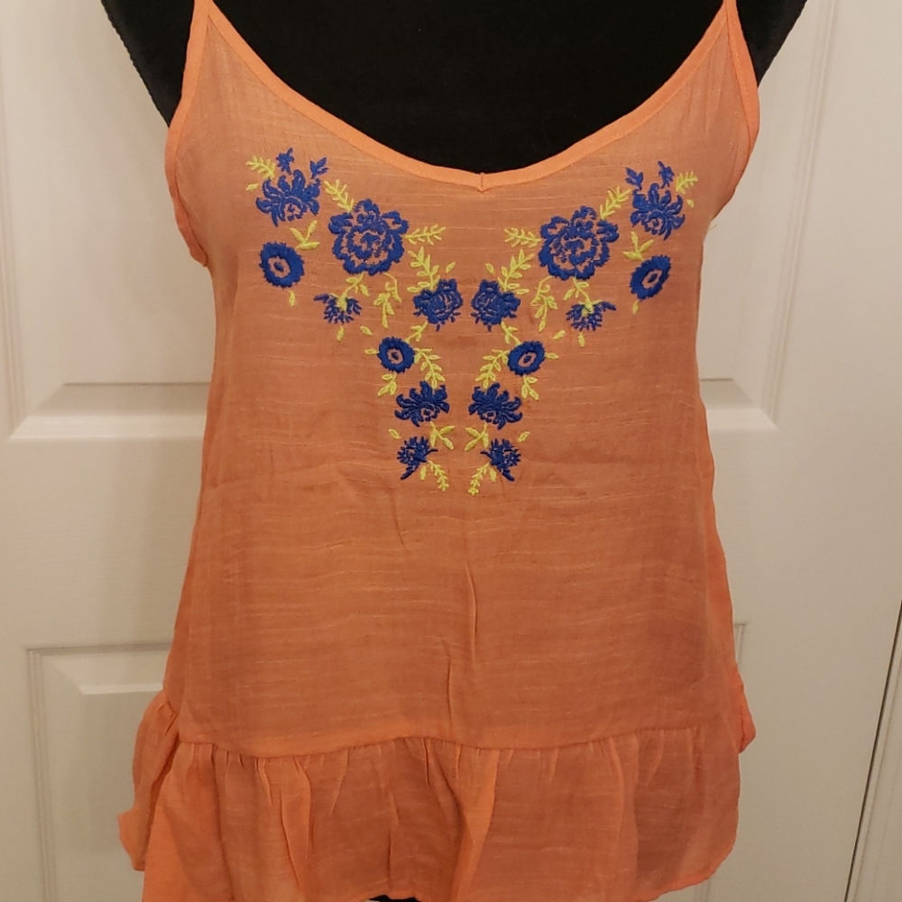 Tangerine tank with floral embroidery and ruffle